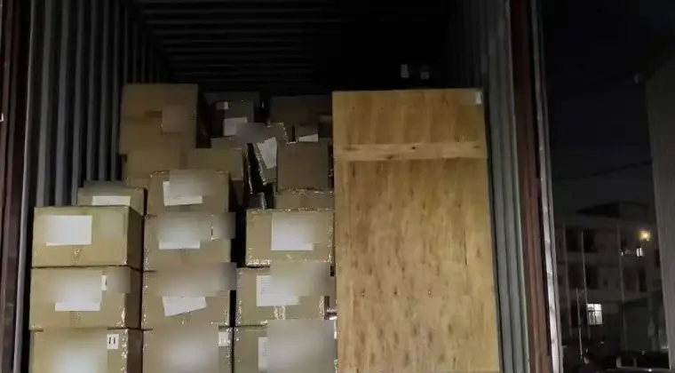 Cartons and a wooden crate loaded for origin transport in Shenzhen